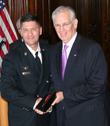 Gov. Nixon Jay Nixon presents the 2014 Medal of Valor to Daniel Roderick of the West County EMS and Fire Protection District.